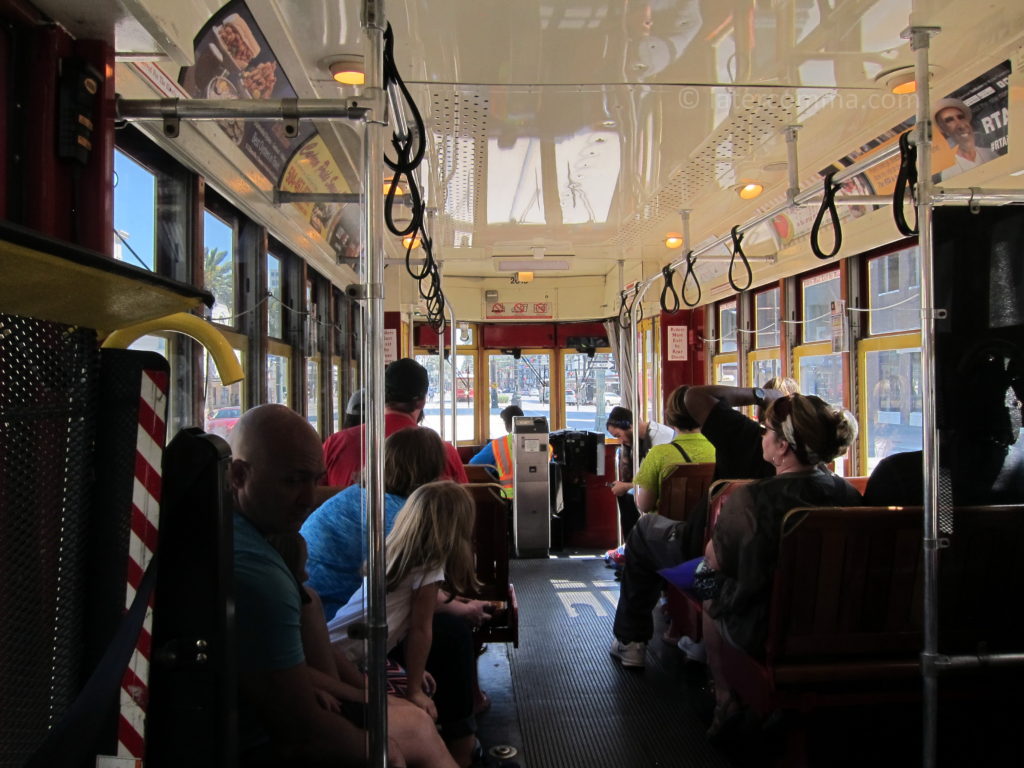 Riding the streetcar along Canal Street.